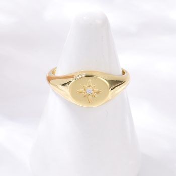 Anillo ovalado estrella  central de zirconia y baño oro 18k