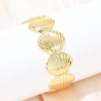 Pulsera bangle conchas baño de oro 18k